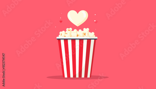 Popcorn in a red and white striped container with a heart above it on a pink background.