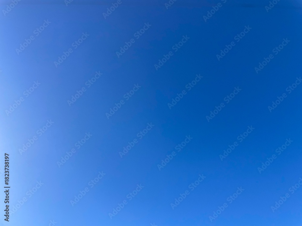 Obraz premium Raw unedited Spanish Iberian clear sky with beautiful light blue gradient. Morning 9am bright sunlight in Autumn. Natural, artistic, artsy and trendy sky blue background template layer. Relaxing, calm