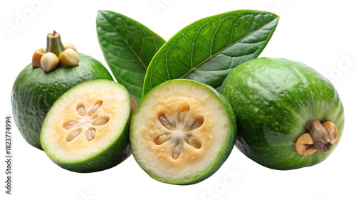 Fresh feijoa fruit, whole and sliced, with its green leaves.