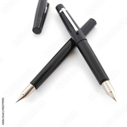 A sleek black fountain pen with a metallic nib and a subtle sheen to its surface, placed on a white background