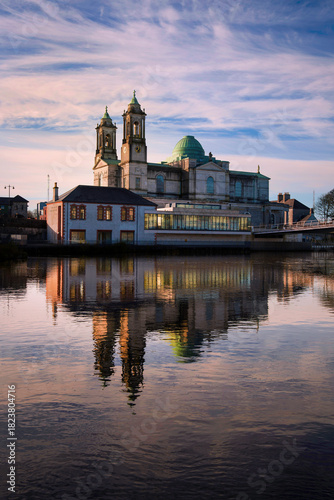 Athlone city sunrise skyline with the Church of Saints Peter and Paul and Athlone Greenway Bridge over the River Shannon in County Westmeath, Ireland.
