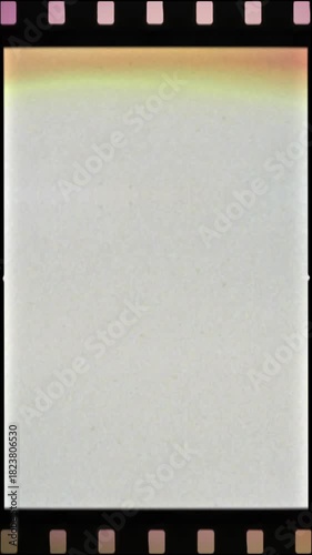 Vertical film frame, analog film negative, film roll background, backdrop for story and reels with noise and light leak
