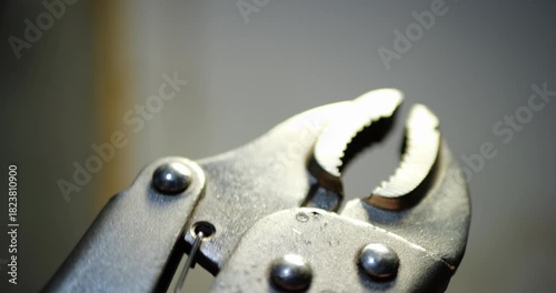 Welding Clamp Close Up Spring Mechanism With Lever Amplified Grip Repeated Clicking Sound Metal Texture Detail Industrial Tool Professional Equipment Workshop Essential DIY Project Construction