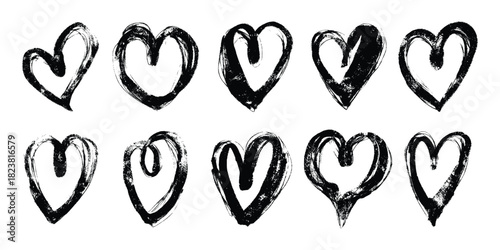 Black Grunge Heart Collection Isolated on White Background. Hand drawn brush love symbols with rough textured Brush strokes and distressed ink lines on white background. Perfect for media, posters