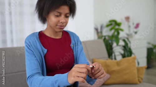 Teenager breaking a cigarette in half