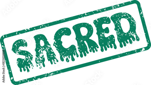 Distressed green rubber stamp bearing the reverent word Sacred on a clear surface for meaningful messaging