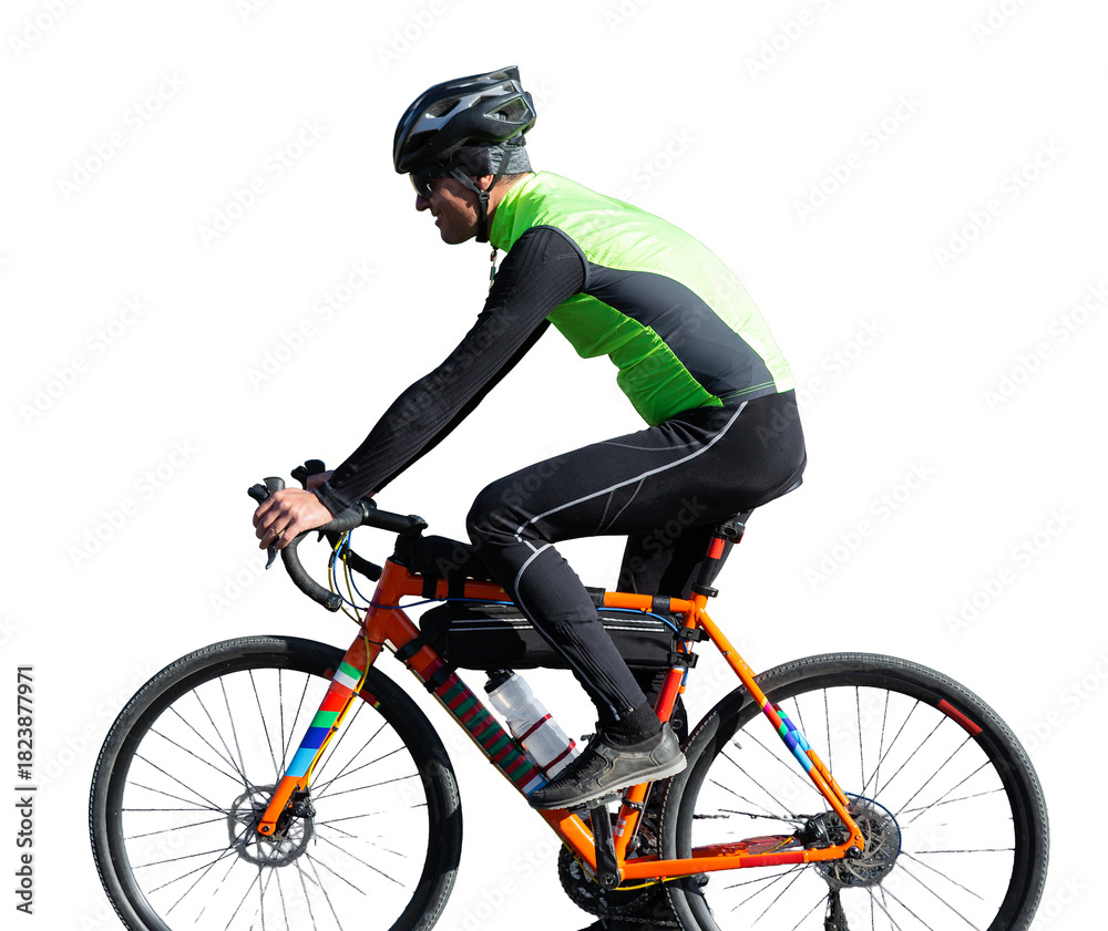 Fototapeta premium Cyclist riding bicycle on road against clear sky