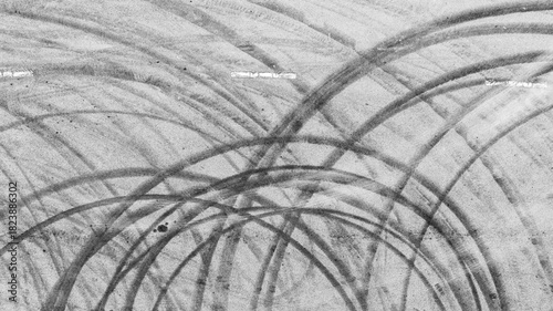 Aerial view abstract asphalt street road background with black tire marks on race track, Texture and background car automobile and automotive skid tire marks.