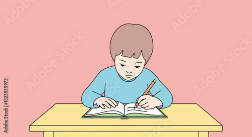 Boy is sitting at the table and writing in a notebook with a pencil. Education concept.