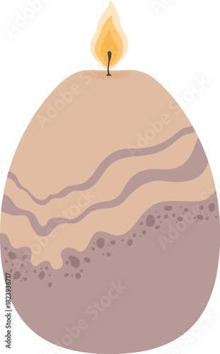 Burning patterned egg shaped candle creating soft light