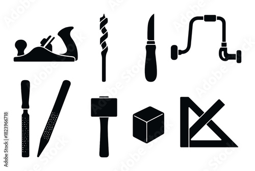 Silhouettes of carpentry tools on dark wood texture background
