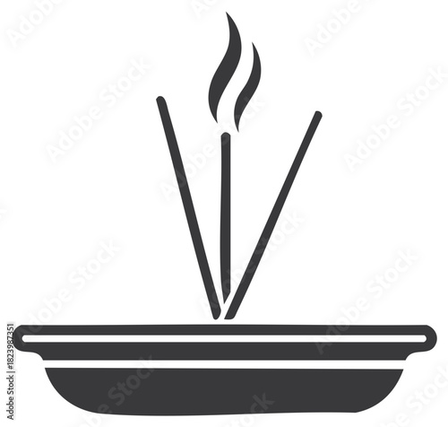 Incense sticks burning, with fire in the vessel.