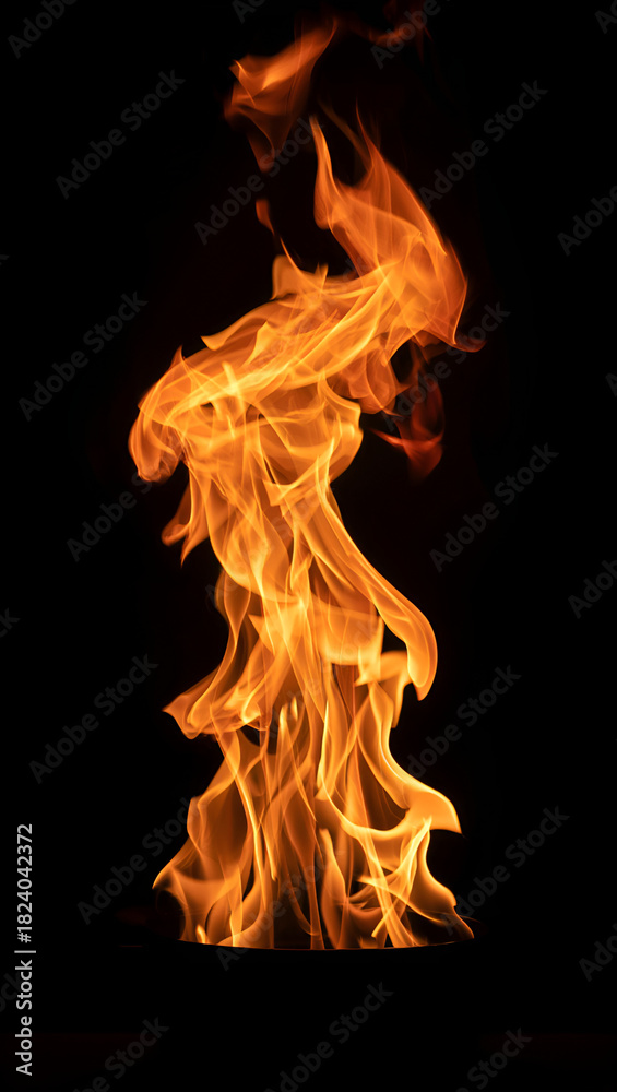 Fototapeta premium Dynamic orange fire flames on a dark isolated background concept