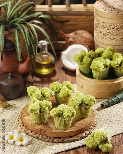 Bolu kukus pandan. Pandan cake blooms, very soft with a distinctive pandan aroma