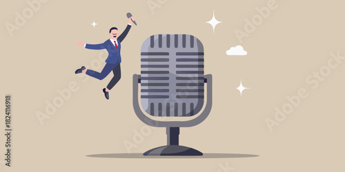 Excited businessman jumps with microphone next to vintage microphone