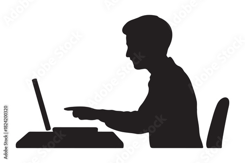  Man working on laptop computer at desk in silhouette