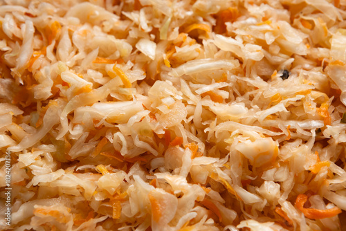 Food background fermented cabbage with carrot sauerkraut close up
