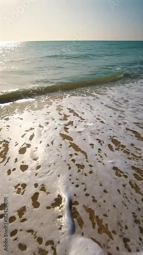Waves gently crashing on the beach.