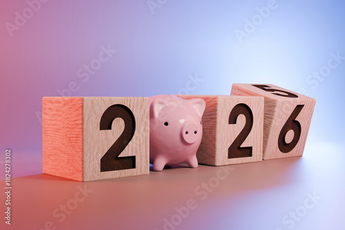 2026 financial concept with a pink piggy bank and wooden number blocks. Saving money and investment planning for the New Year. Vibrant red and blue background. Pig money 2026, creative idea