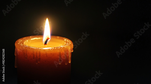 Warm candlelight glows in the darkness, creating a peaceful and serene mood