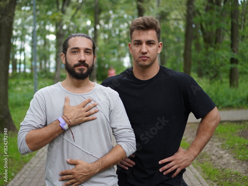 portrait of two happy man in a park