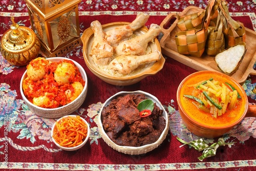 Ketupat Lebaran atau Eid Ketupat. The dishes served during Eid al-Fitr and Eid al-Adha are Ketupat, Opor Ayam, Rendang, Telur Balado, Sayur Labu Siam. Selective Focus .