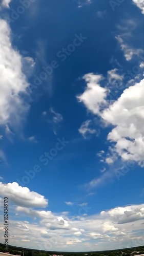 Clouds moving quickly across a blue sky (time-lapse)