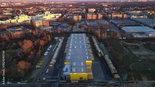 Long yellow DHL distribution center Berlin. Best aerial view flight drone