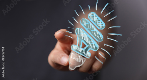 A person's hand pointing at...