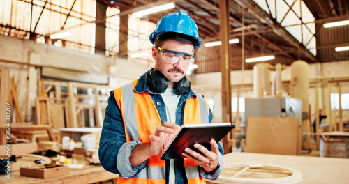 Carpenter, online and man with tablet, workshop and plan for furniture production on web or research. Serious, entrepreneur and person with tech for inventory, scroll and project in small business