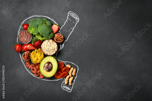 Healthy diet for human stomach: oatmeal, flax, banana, green broccoli, fresh avocado and other healthy vegetables and fruits. Healthy food clean eating selection.