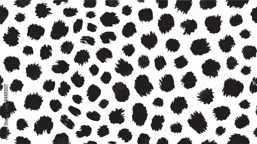 A detailed close up of a black and white spotted pattern resembling animal print