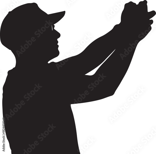 Silhouette of a person in a baseball cap taking a photo with a smartphone