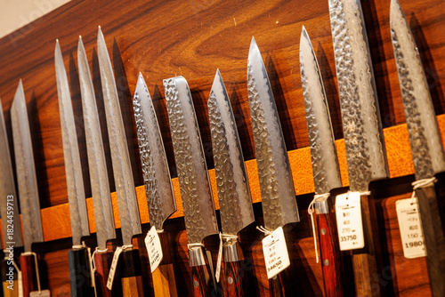 Display of Japanese Kitchen Knives on Wooden Wall