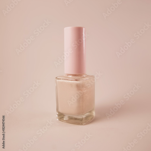 Light beige nail polish bottle mockup with soft pink cap