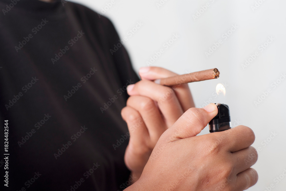 Fototapeta premium Lighting Tobacco Stick with Flame