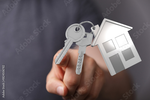 Person hand holding house k...