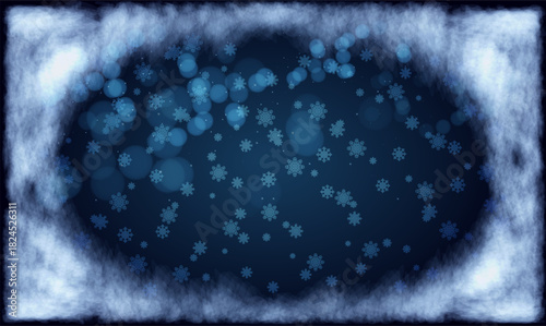 Snowflakes gracefully fall in a winter wonderland with a deep blue backdrop under a cloudy sky