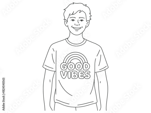 A young boy smiles while wearing a t-shirt with "GOOD VIBES" and a rainbow graphic.