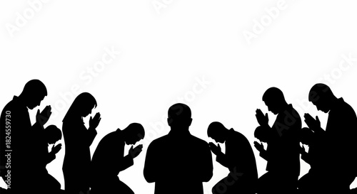 Silhouettes of people kneeling in prayer or worship.