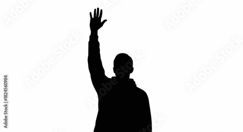 Silhouette of a Person Raising Hand in Greeting or Farewell.