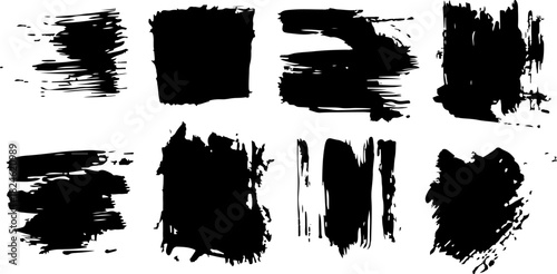 Collection of black ink brush strokes and textures on light background