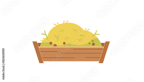 Large yellow hay bale in wooden crate.