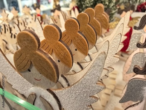 Charming wooden angels lined up in a festive holiday display