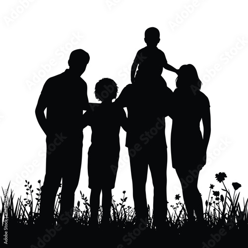 Silhouette of a happy family with children in a field of flowers