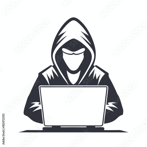 Faceless hacker in hood types on computer illustrating anonymity and cyber security