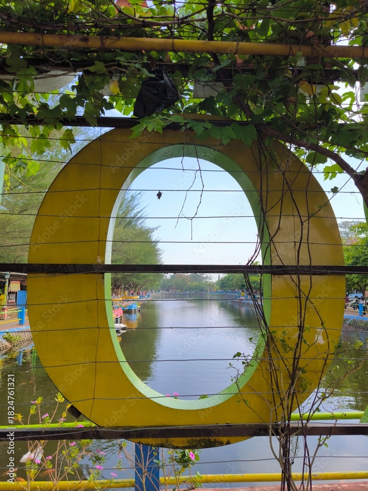 Fototapeta premium View of the tourist lake from an O shape window.