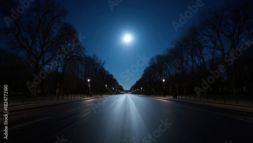  Empty straight road at night with street lights, trees lining both sides, full moon in dark blue sky, symmetrical perspective, urban avenue