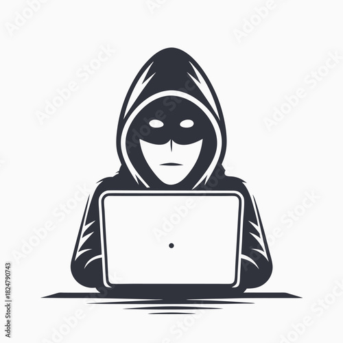 Mysterious hacker figure in hoodie is using laptop for anonymous web activity