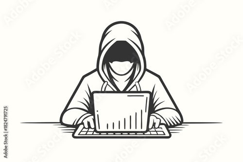 Monochrome hooded figure types quickly on a laptop, their identity hidden from view